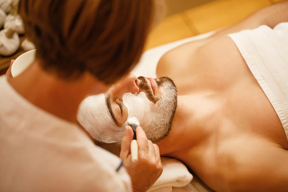 Man enjoys facial treatment
