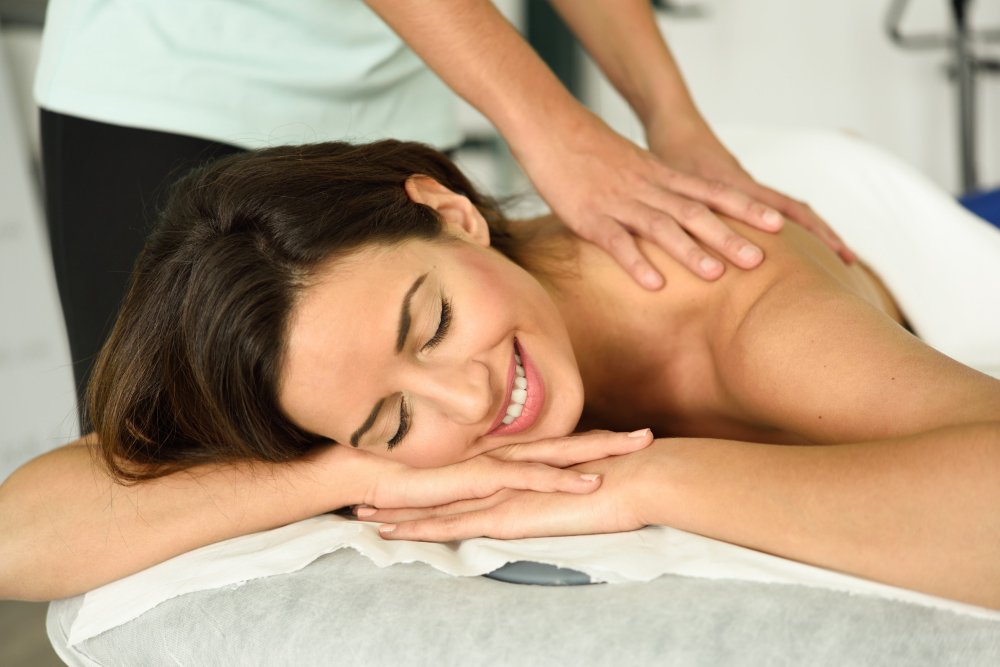 woman receiving one of the types of body massages